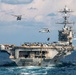 Nimitz-class aircraft carrier USS Harry S. Truman (CVN 75), left, and Arleigh Burke-class guided-missile cruiser USS San Jacinto (CG 56), right, conduct a vertical replenishment and replenishment-at-sea.