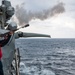 Gunner’s Mate 3rd Class Elvis Chavez, from Paterson, N.J., fires a shot line