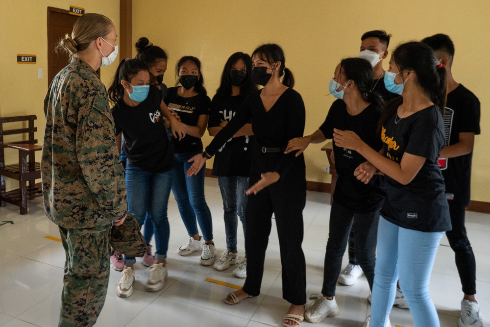 Armed Forces of the Philippines and U.S. Marines visit a local church ahead of Balikatan 22