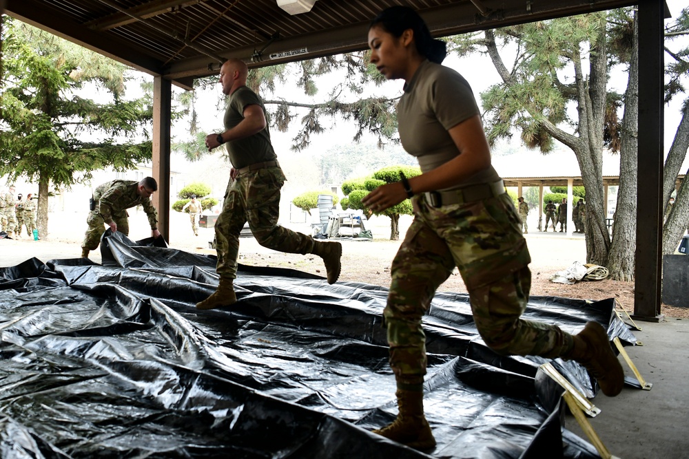 Wolf Pack medics assemble decon shelter systems