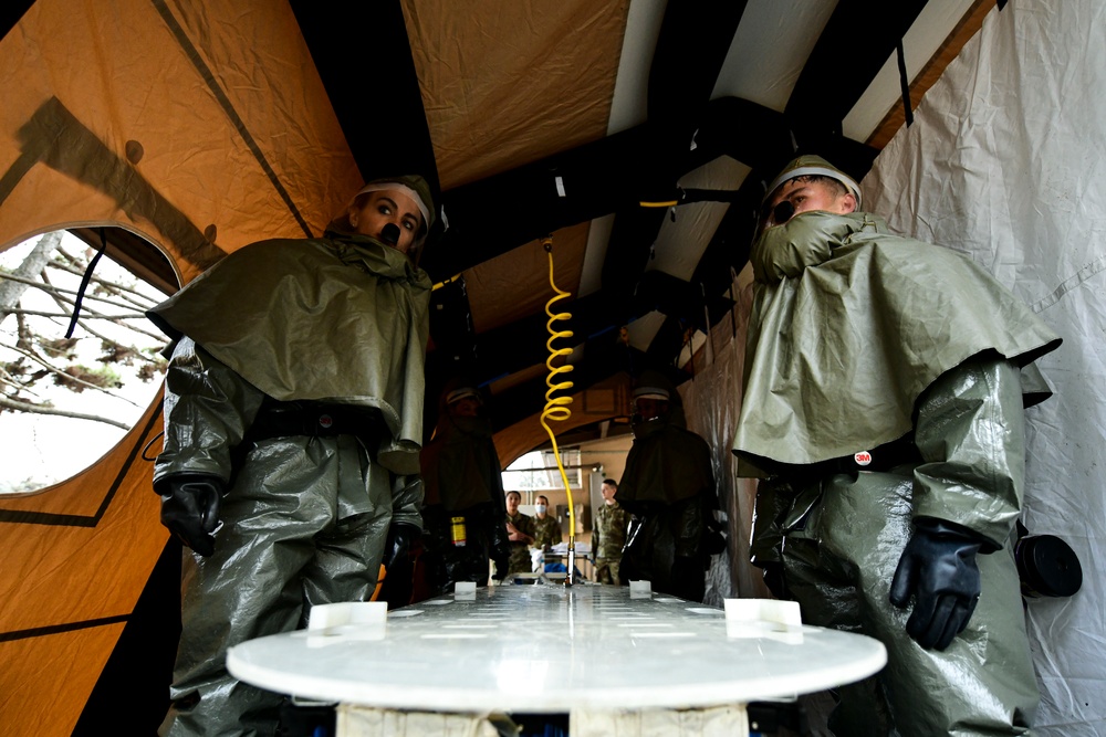 Wolf Pack medics assemble decon shelter systems