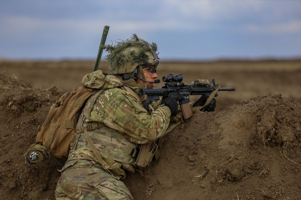 U.S. Army Soldiers work with Romanian forces during a Combined Arms Live Fire Exercise.