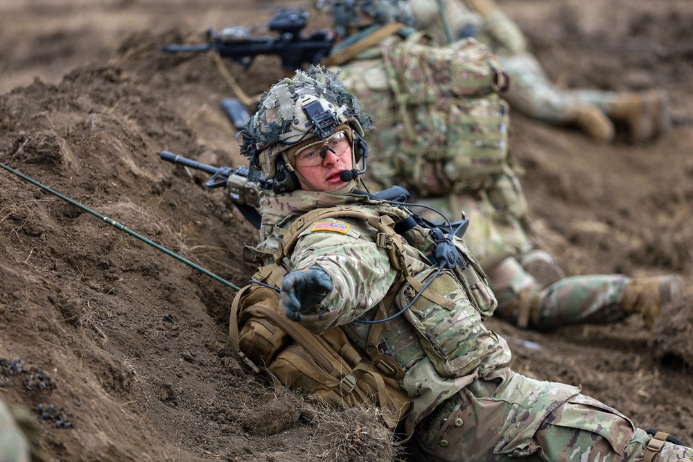 U.S. Army Soldiers work with Romanian forces during a Combined Arms Live Fire Exercise.