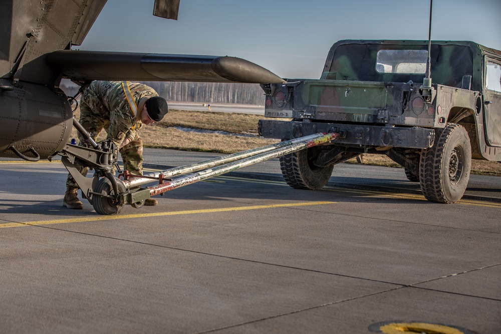 Disconnecting an AH-64D Apache Longbow from a tow bar