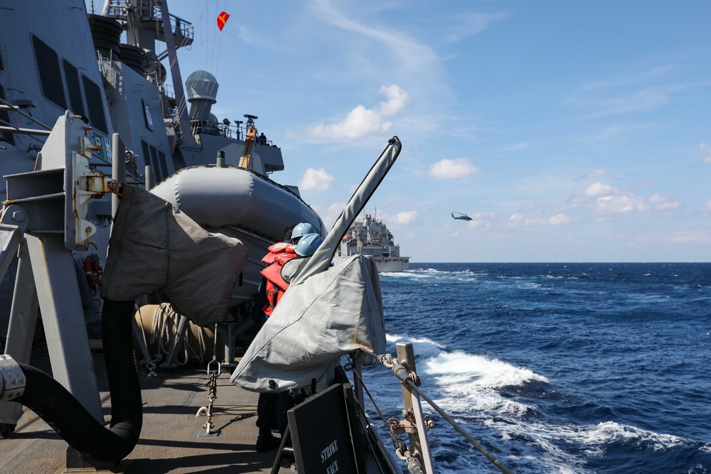 USS Ross replenishes at sea with USNS Robert E. Peary