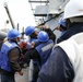 USS Ross replenishes at sea with USNS Robert E. Peary