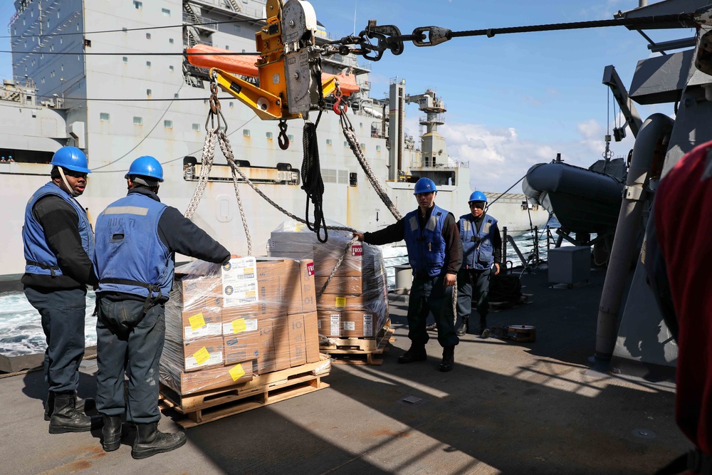 USS Ross replenishes at sea with USNS Robert E. Peary