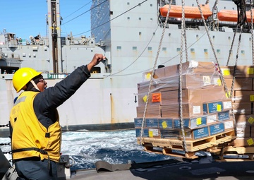 USS Ross replenishes at sea with USNS Robert E. Peary