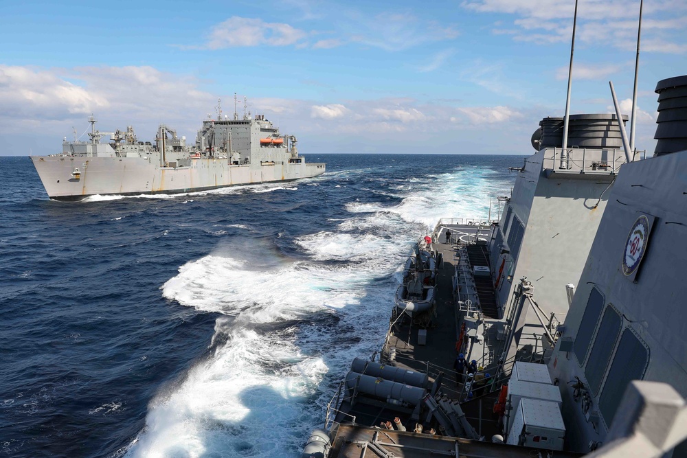 USS Ross replenishes at sea with USNS Robert E. Peary