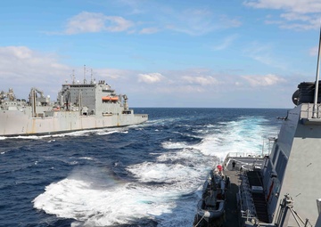 USS Ross replenishes at sea with USNS Robert E. Peary