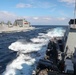 USS Ross replenishes at sea with USNS Robert E. Peary