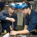 Abraham Lincoln Sailors conduct maintenance