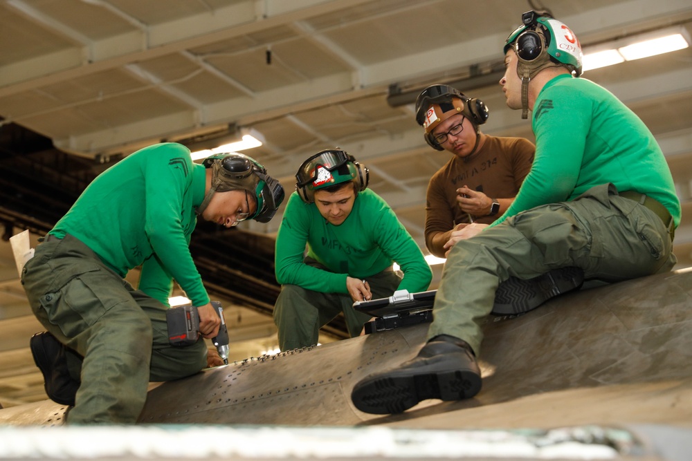 Abraham Lincoln Sailors conduct aircraft maintenance