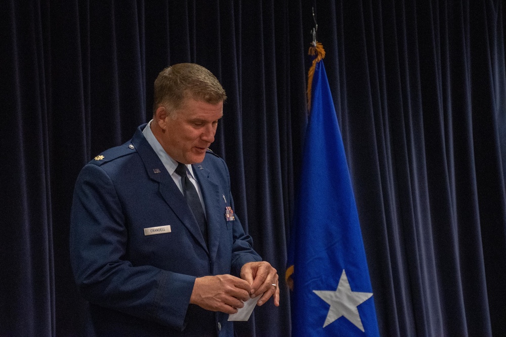 THE INVOCATION: Maj. Donny Crandell, 152nd Airlift Wing Chaplain, performs invocation