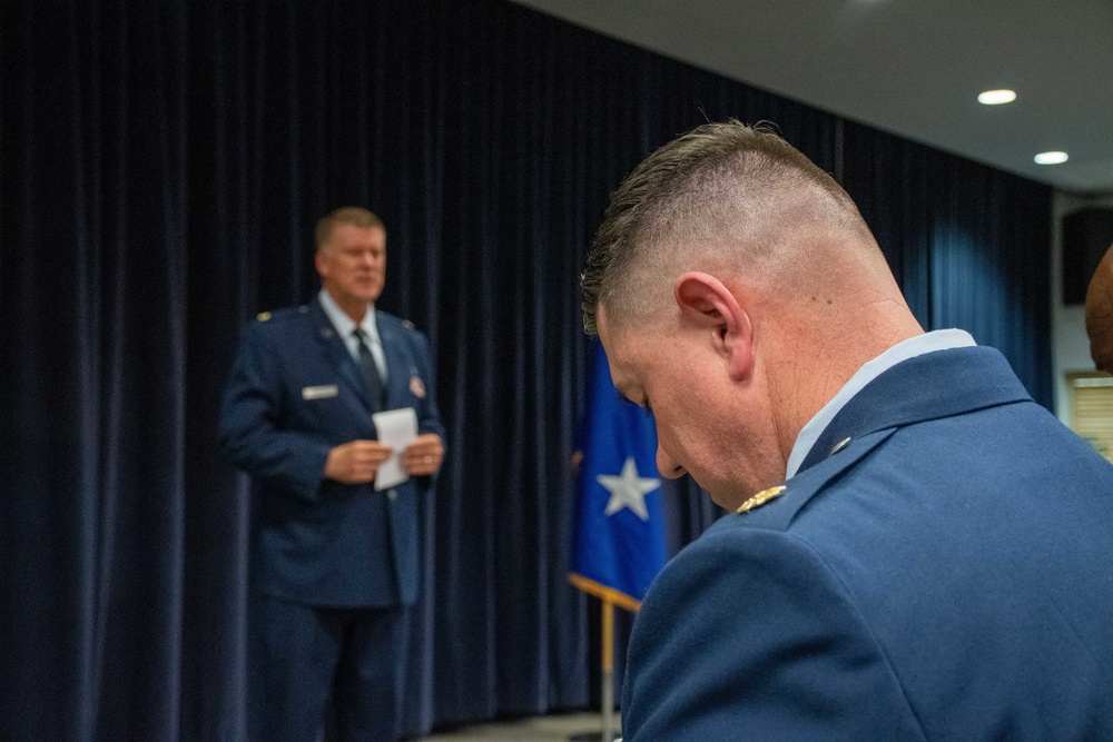 THE INVOCATION: Maj. Donny Crandell, 152nd Airlift Wing Chaplain, performs invocation