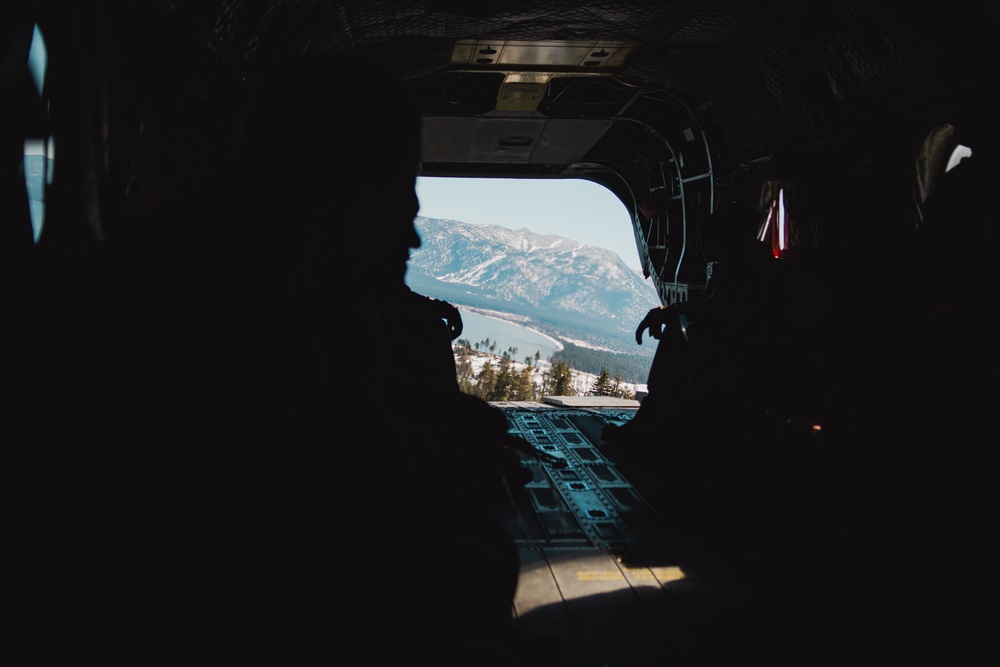 Nevada Air Guard Airmen and Leadership fly on a Chinook over Lake Tahoe