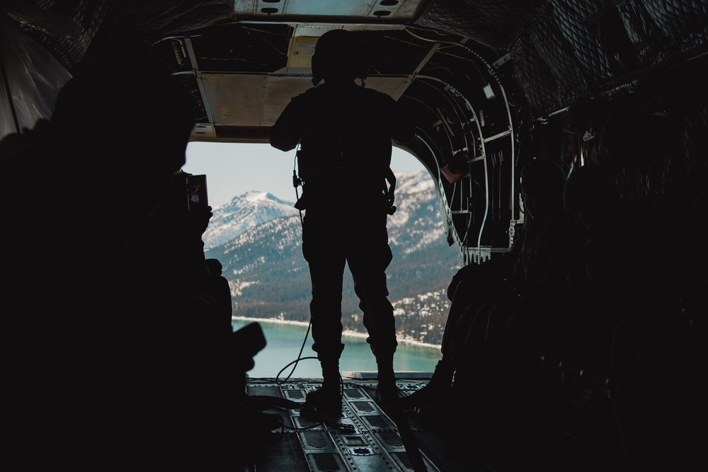 Nevada Air Guard Airmen and Leadership fly on a Chinook over Lake Tahoe