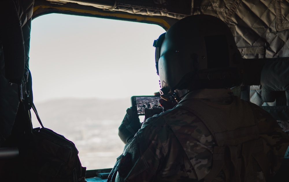 Nevada Air Guard Airmen and Leadership fly on a Chinook over Lake Tahoe