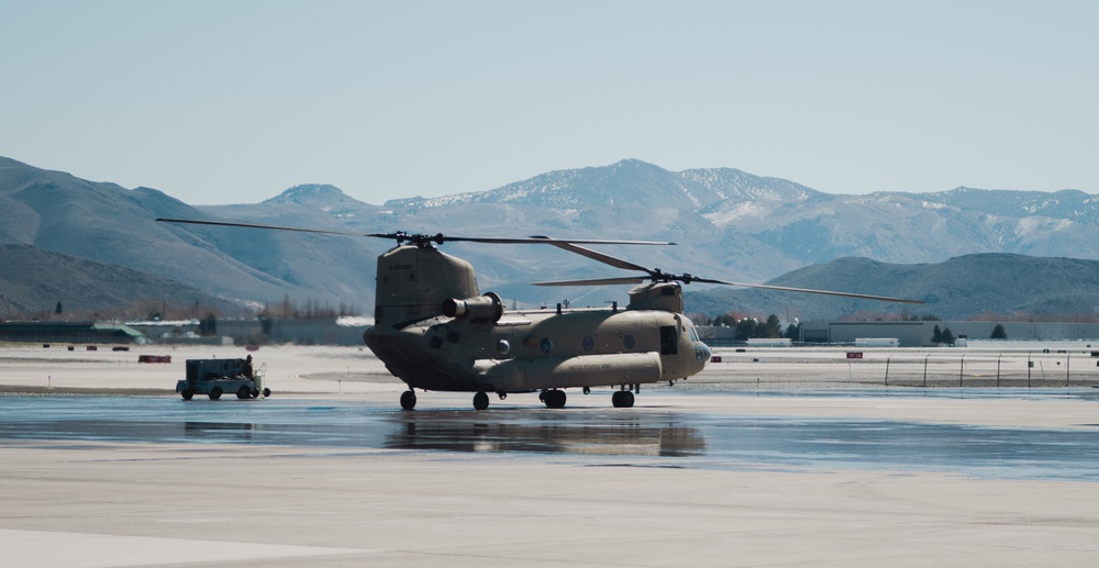 Nevada Air Guard Airmen and Leadership fly on a Chinook over Lake Tahoe