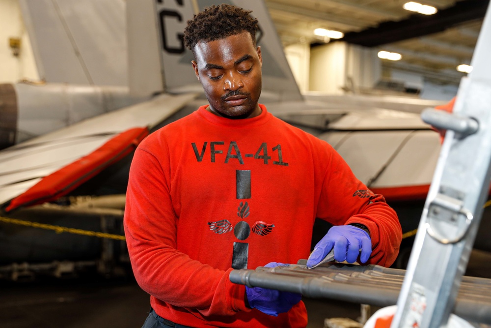 Abraham Lincoln Sailors conduct aircraft maintenance