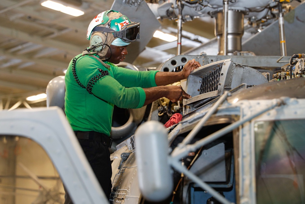 Abraham Lincoln Sailors conduct aircraft maintenance