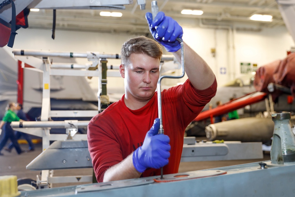 Abraham Lincoln Sailors conduct aircraft maintenance