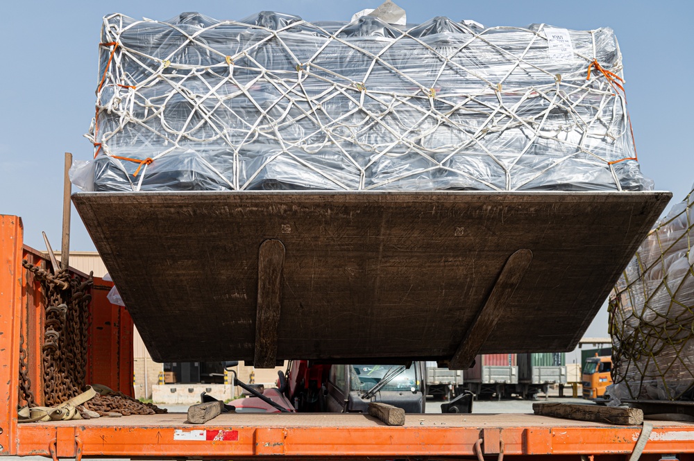 Shipping a piece of home overseas: service members work together to deliver mail Shipping a piece of home overseas: service members work together to deliver mail