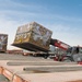 Shipping a piece of home overseas: service members work together to deliver mail