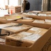 Shipping a piece of home overseas: service members work together to deliver mail