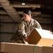 Shipping a piece of home overseas: service members work together to deliver mail