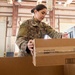 Shipping a piece of home overseas: service members work together to deliver mail