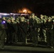 Warrant Officer Candidates step off for ruck march