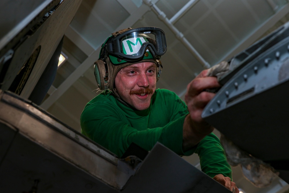 Abraham Lincoln Sailors conduct aircraft maintenance