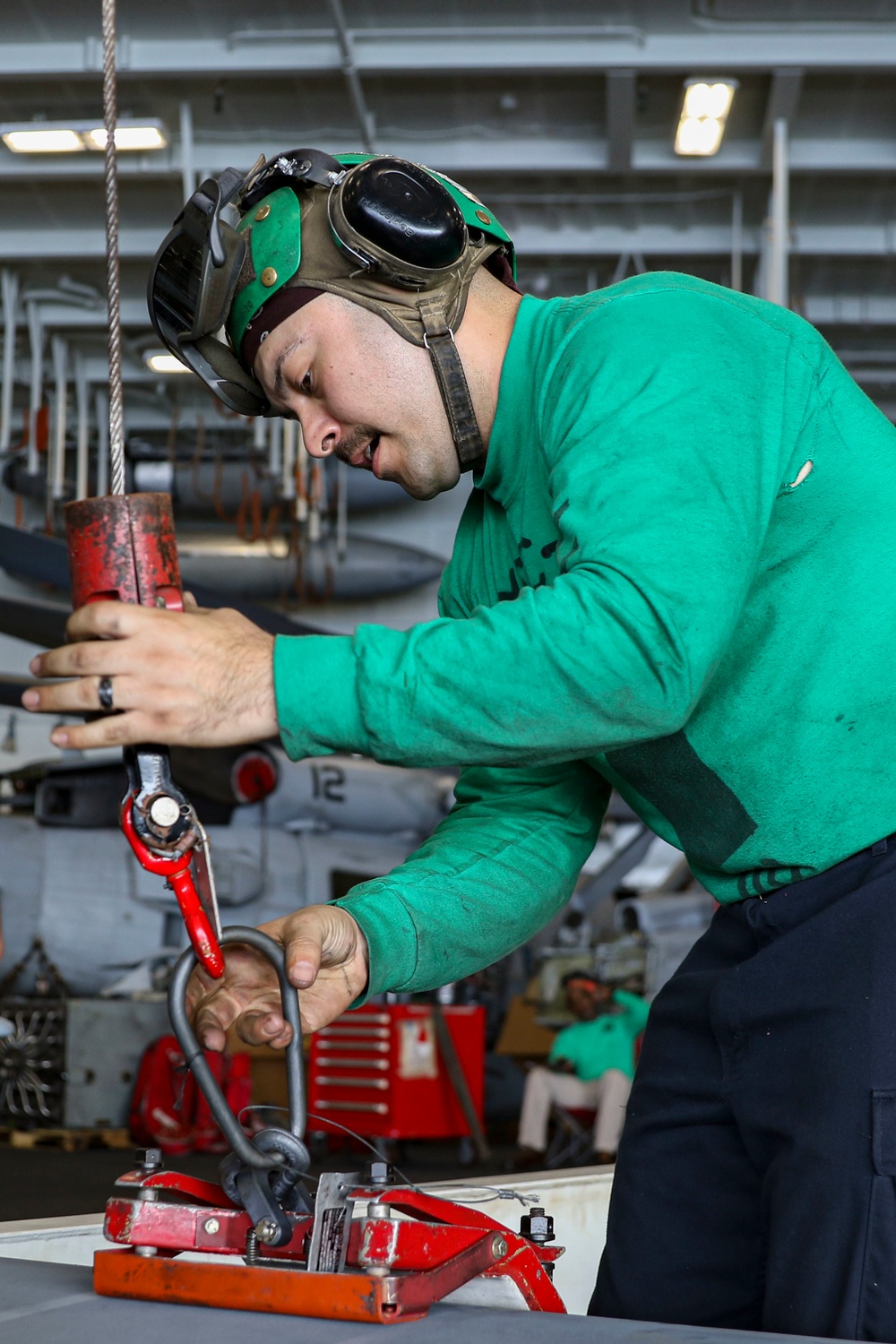 Abraham Lincoln Sailors conduct aircraft maintenance