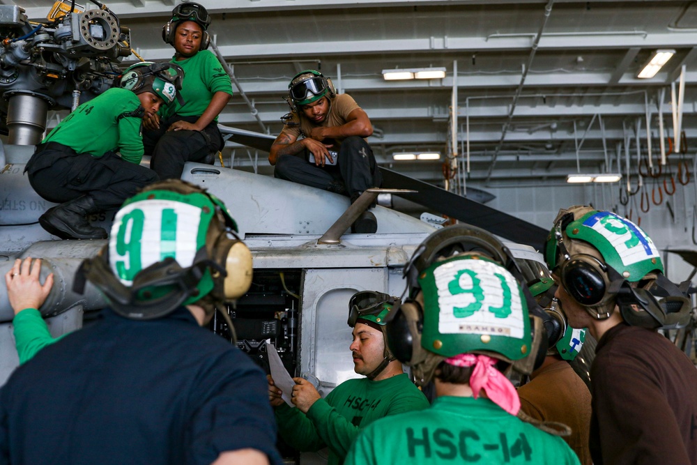 Abraham Lincoln Sailors conduct aircraft maintenance