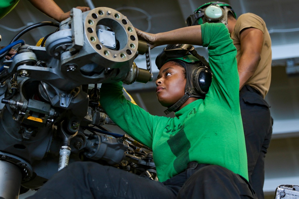 Abraham Lincoln Sailors conduct aircraft maintenance