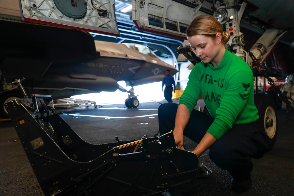 Abraham Lincoln Sailors conduct aircraft maintenance