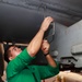 Abraham Lincoln Sailors conduct aircraft maintenance