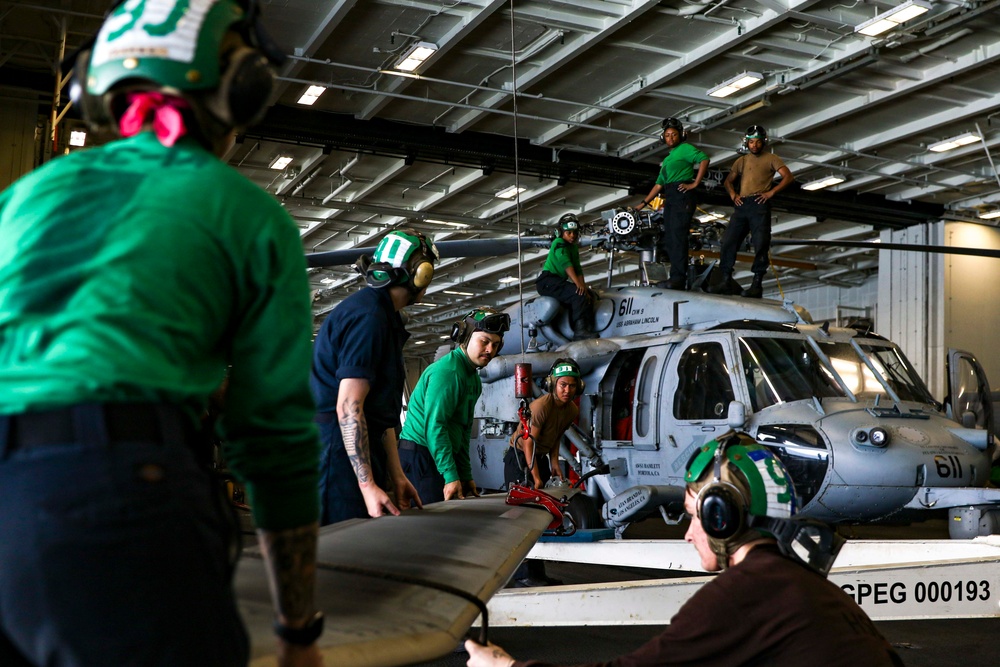 Abraham Lincoln Sailors conduct aircraft maintenance