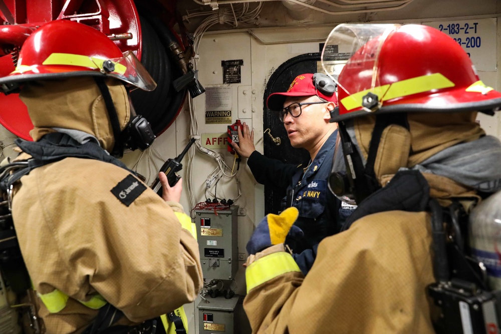 USS Ross Sailors conduct main space fire drill