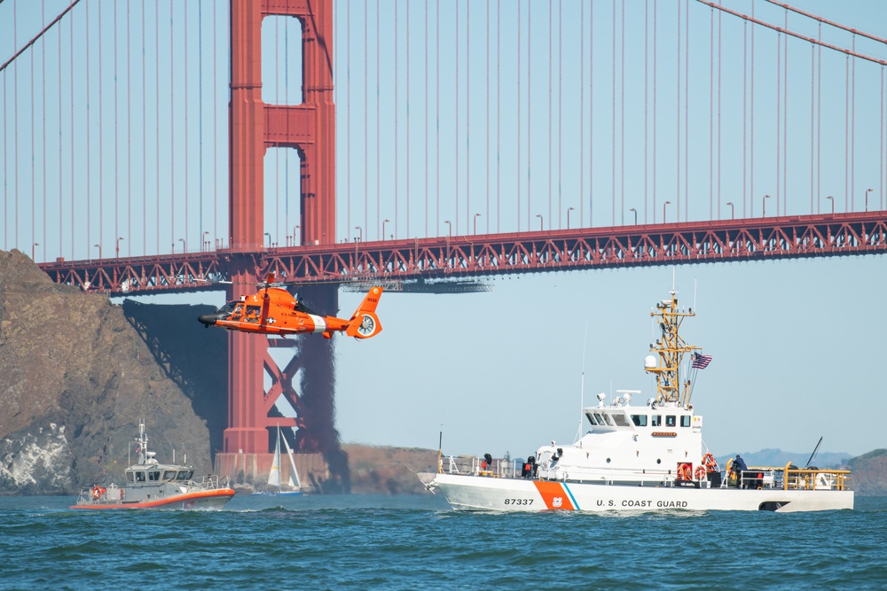 Coast Guard Bay Area assets pose for group photo with a 9/11 commemorative flag