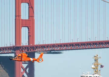Coast Guard Bay Area assets pose for group photo with a 9/11 commemorative flag