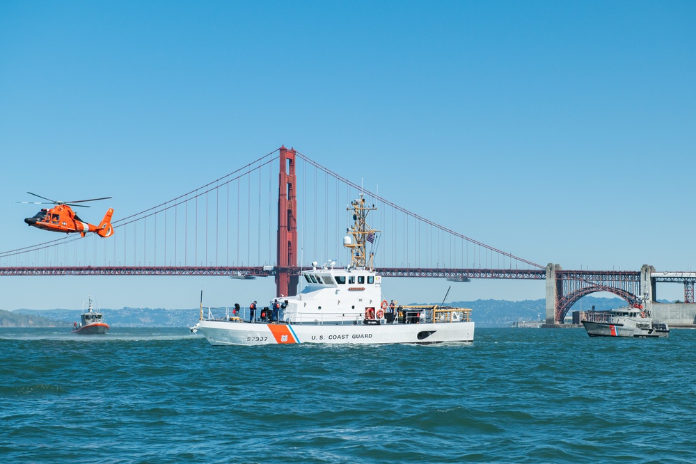 Coast Guard Bay Area assets pose for group photo with a 9/11 commemorative flag