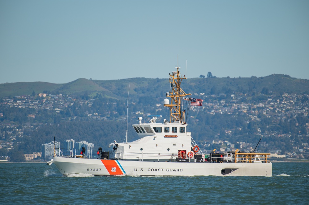 Coast Guard Bay Area assets pose for group photo with a 9/11 commemorative flag