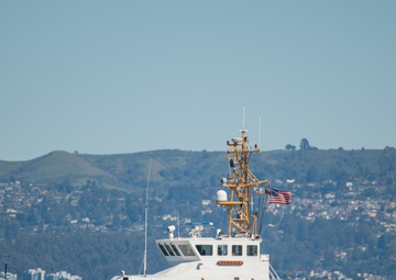 Coast Guard Bay Area assets pose for group photo with a 9/11 commemorative flag