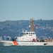 Coast Guard Bay Area assets pose for group photo with a 9/11 commemorative flag