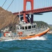 Coast Guard Bay Area assets pose for group photo with a 9/11 commemorative flag