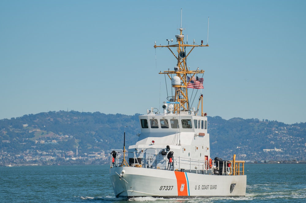 Coast Guard Bay Area assets pose for group photo with a 9/11 commemorative flag