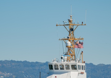 Coast Guard Bay Area assets pose for group photo with a 9/11 commemorative flag