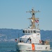 Coast Guard Bay Area assets pose for group photo with a 9/11 commemorative flag